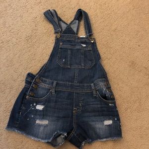 Ripped denim overalls